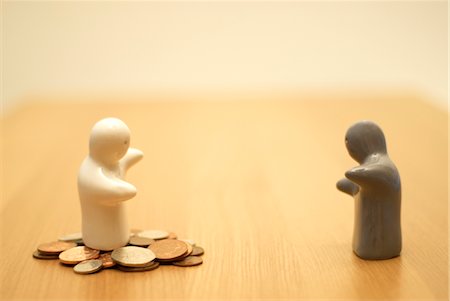 small figures with money Stock Photo - Premium Royalty-Free, Code: 649-03294403