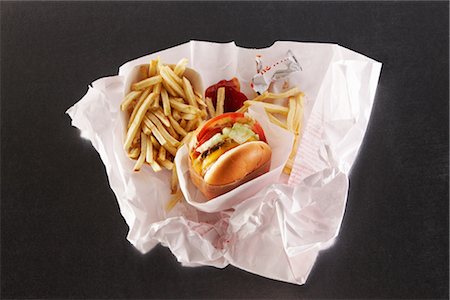 french fry top view nobody - Fast food in take out paper bag Stock Photo - Premium Royalty-Free, Code: 649-03294658