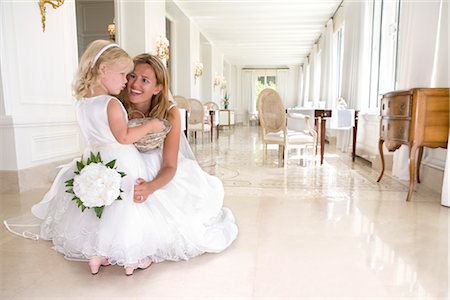 bride with young flower girl talk Stock Photo - Premium Royalty-Free, Code: 649-03295901