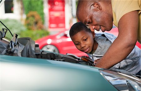 father teaching his child - father & son working on car engine Stock Photo - Premium Royalty-Free, Code: 649-03296056