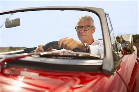 eyeglasses travel - Senior man in sports car Stock Photo - Premium Royalty-Free, Code: 649-03296525