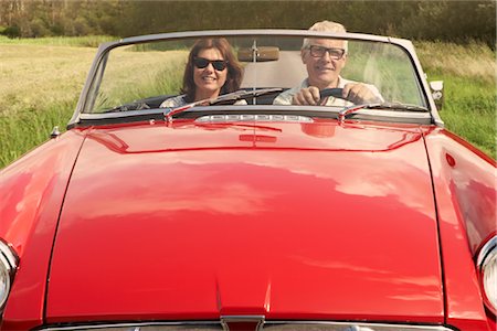 Mid aged couple in sports car Stock Photo - Premium Royalty-Free, Code: 649-03296553