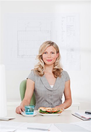Businesswoman with healthy lunch. Stock Photo - Premium Royalty-Free, Code: 649-03297092