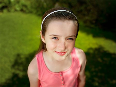 A portrait of a girl in a garden Stock Photo - Premium Royalty-Free, Code: 649-03297338