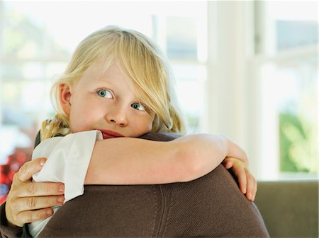 simsearch:632-08129913,k - A little girl hugging a loved one Stock Photo - Premium Royalty-Free, Code: 649-03297361