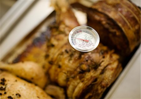 roasting thermometer - A thermometer testing some meat Stock Photo - Premium Royalty-Free, Code: 649-03297503