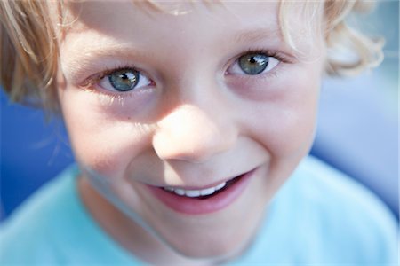 fascinated - Portrait of boy smiling Stock Photo - Premium Royalty-Free, Code: 649-03297565
