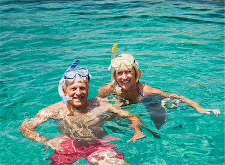 simsearch:649-06622377,k - A senior couple swimming with snorkels Stock Photo - Premium Royalty-Free, Code: 649-03291897