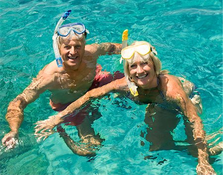 simsearch:649-06622377,k - A senior couple swimming with snorkels Stock Photo - Premium Royalty-Free, Code: 649-03291898