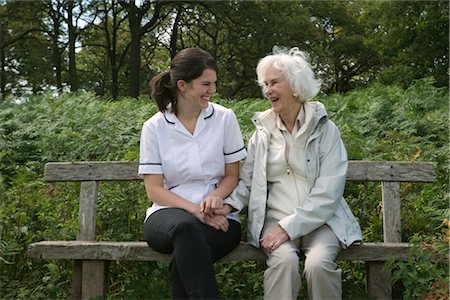 elderly person lifestyle - Nurse holding hand of elderly woman Stock Photo - Premium Royalty-Free, Code: 649-03292139