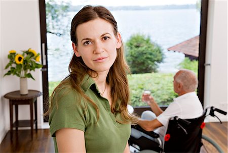 disabled seniors - woman caring for man in wheelchair Stock Photo - Premium Royalty-Free, Code: 649-03292663