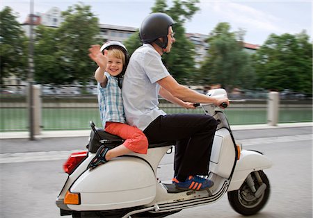 son driving father sitting - father and son on scooter Stock Photo - Premium Royalty-Free, Code: 649-03292775