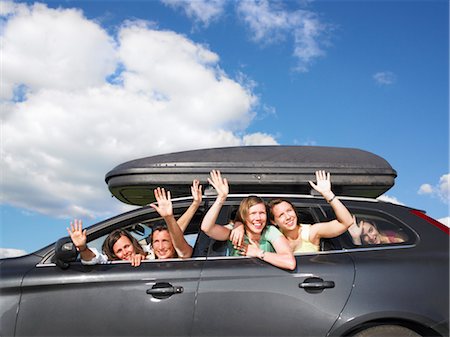 female driver passenger - girls waving out of car windows Stock Photo - Premium Royalty-Free, Code: 649-03293766