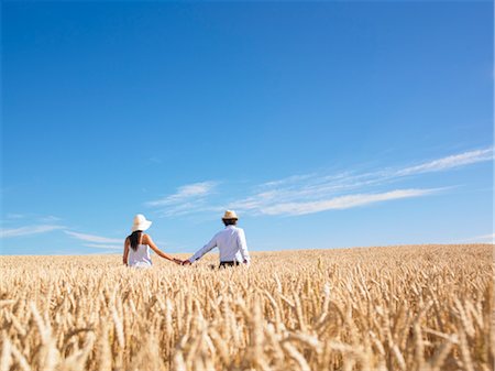 young couple in wheat field Stock Photo - Premium Royalty-Free, Code: 649-03293812