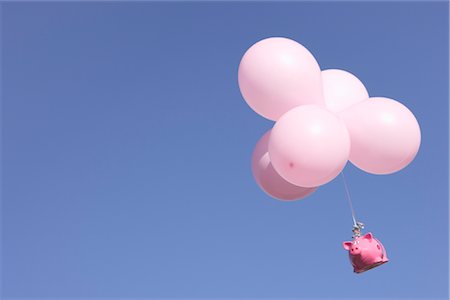 simsearch:649-06040095,k - Piggy Bank flying with balloons Fotografie stock - Premium Royalty-Free, Codice: 649-03362732