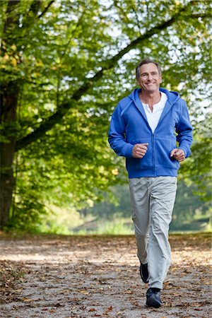 Middle aged man jogging Stock Photo - Premium Royalty-Free, Code: 649-03363273