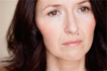 disappointment - woman looking into distance Stock Photo - Premium Royalty-Free, Code: 649-03363482