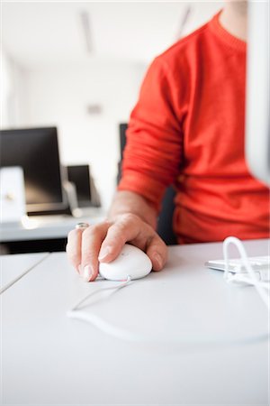 man using computer mouse Stock Photo - Premium Royalty-Free, Code: 649-03363539