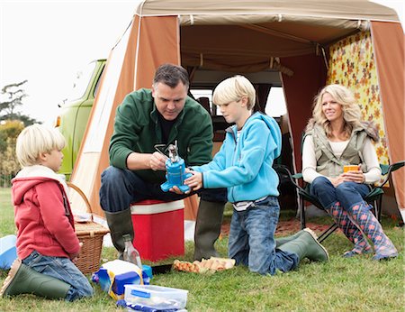 parent teaching outdoor - Family setting up camp Stock Photo - Premium Royalty-Free, Code: 649-03417594