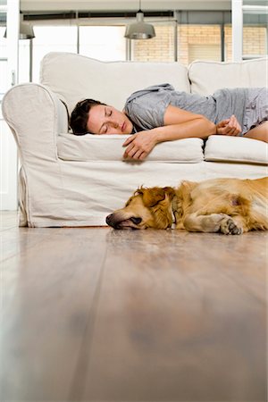 dog sleeping couch - Woman at home Stock Photo - Premium Royalty-Free, Code: 649-03418046