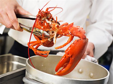 restaurant kitchen - A Lobster being lifted out of the pot Stock Photo - Premium Royalty-Free, Code: 649-03418389