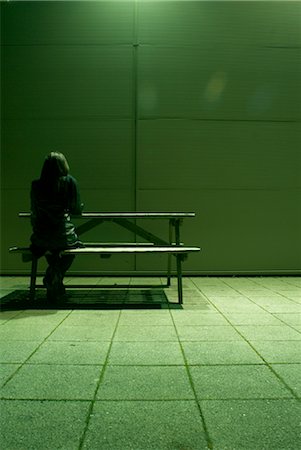 lone woman sitting at bench Stock Photo - Premium Royalty-Free, Code: 649-03418432