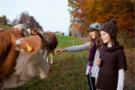 farm girls cows - Two girls at a pasture with cows Stock Photo - Premium Royalty-Free, Code: 649-03418532