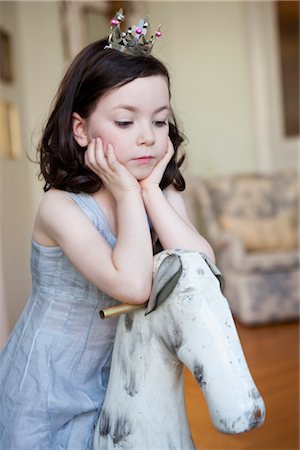 girl resting her head on her hands Stock Photo - Premium Royalty-Free, Code: 649-03418681