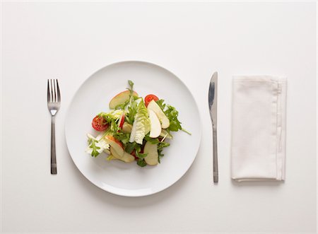 fork and knife white background - A plate of salad Stock Photo - Premium Royalty-Free, Code: 649-03418697