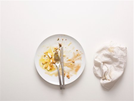 A knife and fork on an empty plate Foto de stock - Sin royalties Premium, Código: 649-03418708