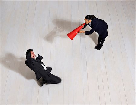 dominant women - Business woman shouting at man on floor Foto de stock - Sin royalties Premium, Código: 649-03446894