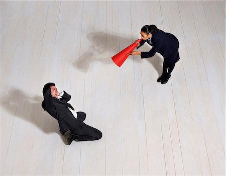 dominant woman - Business woman shouting at man on floor Foto de stock - Sin royalties Premium, Código: 649-03446894