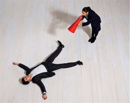 dominant women - Business woman shouting at man on floor Foto de stock - Sin royalties Premium, Código: 649-03446893