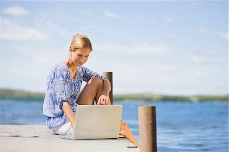 simsearch:649-03362975,k - Woman working lake-side Stock Photo - Premium Royalty-Free, Code: 649-03447180