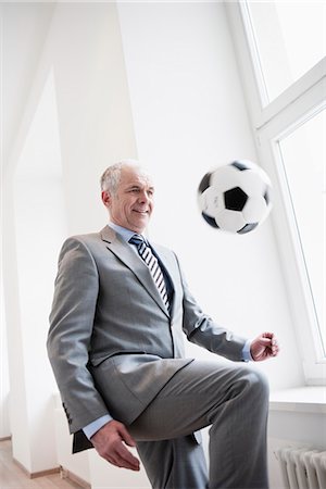 soccer fun - Businessman playing soccer Stock Photo - Premium Royalty-Free, Code: 649-03447494