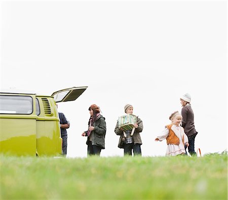 Family and camper van in open field Stock Photo - Premium Royalty-Free, Code: 649-03447754
