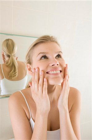 Female beauty in bathroom washing face Stock Photo - Premium Royalty-Free, Code: 649-03447846