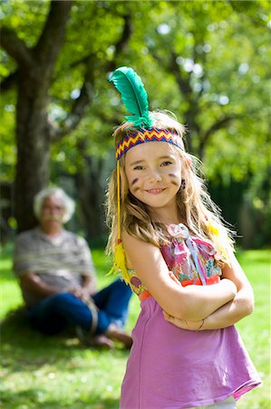 sunlight fun outdoor game - Costumed girl smiling Stock Photo - Premium Royalty-Free, Code: 649-03448391