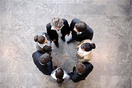 Group of business people forming circle Stock Photo - Premium Royalty-Free, Code: 649-03465553