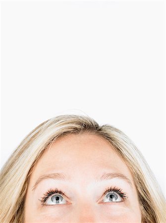 people looking up suprised - Woman looking up to free space Stock Photo - Premium Royalty-Free, Code: 649-03465715