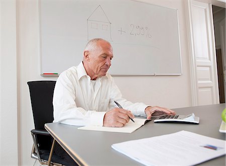 realtor (male) - Businessman working on papers Stock Photo - Premium Royalty-Free, Code: 649-03465855