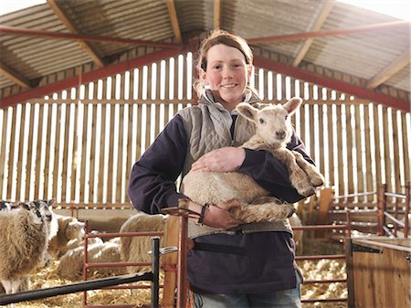 Female Farmer Holding Lamb Stock Photo - Premium Royalty-Free, Code: 649-03466049