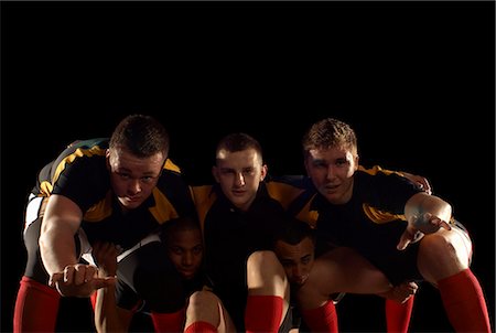 Joueurs de rugby dans la formation de la mêlée Photographie de stock - Premium Libres de Droits, Code: 649-03466228