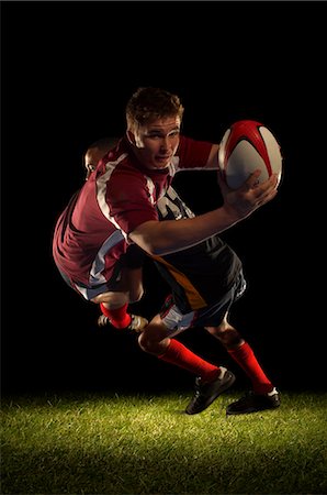 Rugby player being tackled and scoring Stock Photo - Premium Royalty-Free, Code: 649-03466230