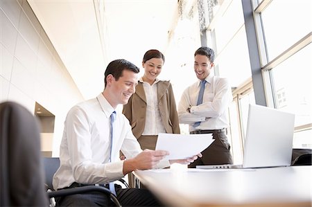 people working together at table - Presentation with young business team Stock Photo - Premium Royalty-Free, Code: 649-03486848