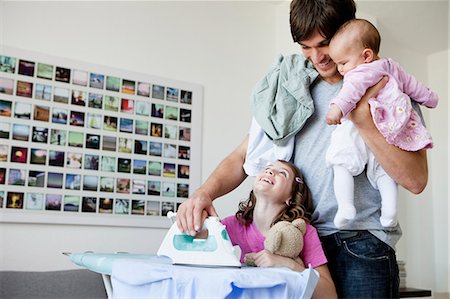 papa multitasking - Family ironing Stock Photo - Premium Royalty-Free, Code: 649-03486947