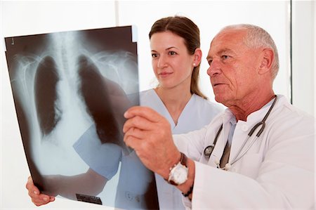 Doctor and nurse looking at x-ray Stock Photo - Premium Royalty-Free, Code: 649-03487193