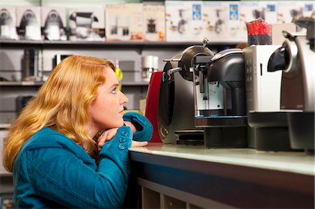 shop appliance - Girl is spoilt for choice Stock Photo - Premium Royalty-Free, Code: 649-03487415