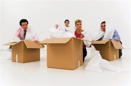 Four workers tired from too much work Stock Photo - Premium Royalty-Free, Code: 649-03487789