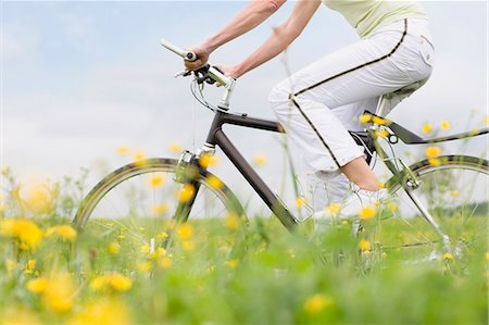 Woman riding bike Stock Photo - Premium Royalty-Free, Code: 649-03566002